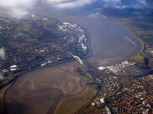 Aerial footage of Silver Jubilee Bridge, a bridge which connects Widnes and Runcorn in Halton